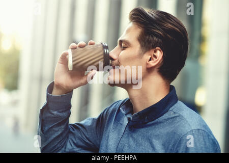 Men drinking coffee.Close-up of men drinking coffee outdoors Stock Photo