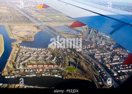 City view from the plane. View from airplane window on the wing