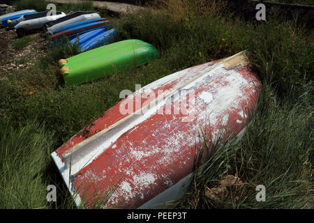 Upturned rowing boats on the edge of the beach at Grande Plage from Mane Rinville, Ile aux Moines, Morbihan, Brittany, France Stock Photo