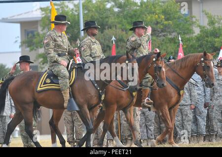 Maj. Gen. Michael Bills (left), 1st Cavalry Division commanding general, performs an inspection of troops with the incoming commander (center), Col. Kevin Admiral, and outgoing commander, Col. Cameron Cantlon, during the change of command ceremony Wednesday on Cooper Field at Fort Hood, Texas. (U.S. Army photo taken by Spc. Erik Warren, 3rd Cavalry Public Affairs) (Released) Stock Photo