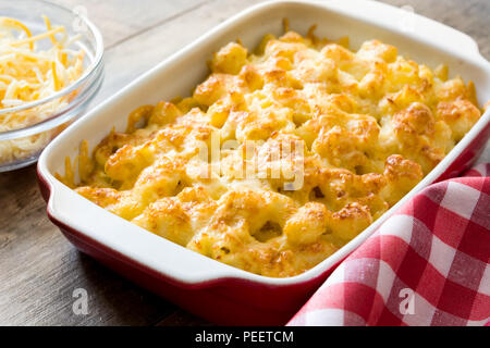 Typical American macaroni and cheese on wooden table Stock Photo