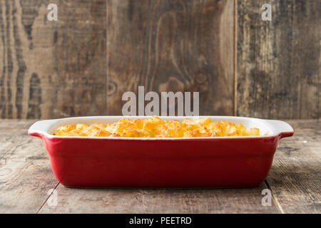 Typical American macaroni and cheese on wooden table Stock Photo