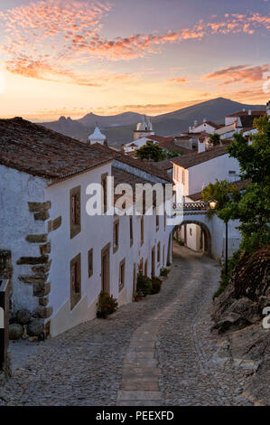 Portugal, the Alentejo, Marvao, historic walled village at dawn. A narrow cobbled street. Stock Photo