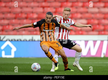 Hull City's Jackson Irvine (left) and Sheffield United's Mark Duffy battle for the ball (left) and during the Carabao Cup, First Round match at Bramall Lane, Sheffield. Stock Photo