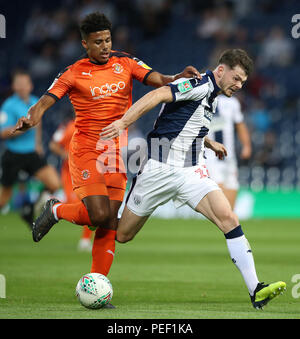 Luton Town's James Justin (left) and West Bromwich Albion's Oliver Burke battle for the ball during the Carabao Cup, First Round match at The Hawthorns, West Bromwich. Stock Photo