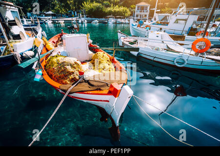 Colorful Greek fishing boats in small port harbor of Kioni on Ithaka island, Greece Stock Photo