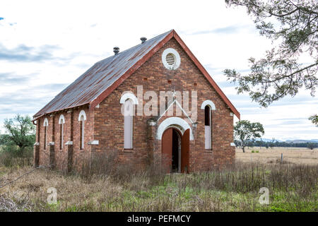 Old abandoned country church in rural setting Stock Photo