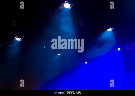 Moody smoke and lights on stage Stock Photo