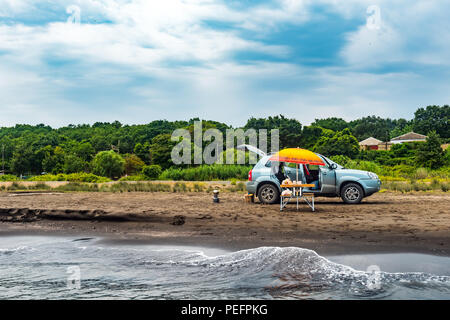 Summer car trip to the sea, picnic on shore Stock Photo