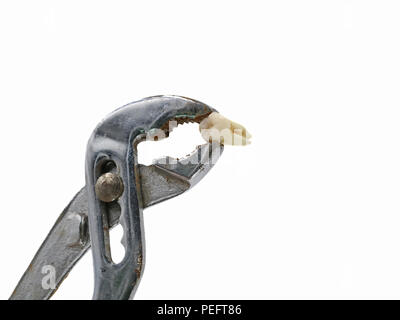 Pulling a tooth with rusty plumber pliers isolated on white with copy space Stock Photo
