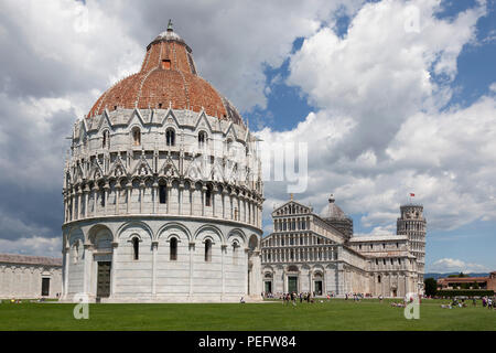 On the 'Field of Miracles' at Pisa (Tuscany - Italy), the Baptistry (under renovation at the time of the shot), the cathedral and the campanile. Stock Photo