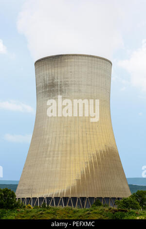 A natural draft cooling tower of a nuclear power plant releasing clouds of water vapor. Stock Photo