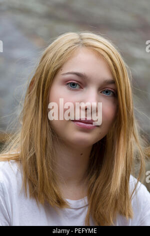 Close up candid portrait of beautiful and pretty 15 year old teenage female caucasian girl Stock Photo