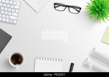 Office desk with supplies and free space in the middle for text. Flat lay. Stock Photo