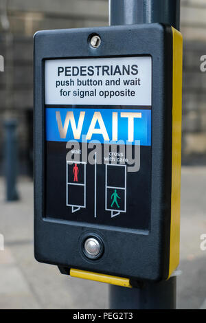Wait Cross Sign People waiting to cross road opposite John Lewis Oxford Street, Central ...
