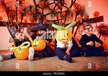 A group of children in costumes on a Halloween holiday Stock Photo