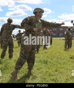 First Lt. Andrew Evans, 1st Battalion physician assistant assigned to Destined Company, 2nd Battalion, 503rd Infantry Regiment, 173rd Airborne Brigade, practices proper jumping procedures to ensure safety of jumpers during an upcoming airborne jump, at Tapa Army Base, Estonia, Aug. 15, as part of Operation Atlantic Resolve. The jumpers practiced for the jump under the careful guidance and instruction of jumpmasters, expert paratroopers dedicated to training and teaching jumping techniques. (U.S. Army photos by Spc. Jacqueline Dowland, 13th Public Affairs Detachment) Stock Photo