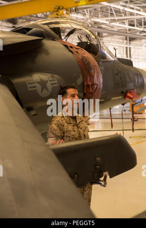 U.S. Marine Corps 1st Lt. Matthew Lake, briefs intelligence specialists about the capabilities and limitations of the AV-8B Harrier during a Squadron Intelligence Training Certification Course class at Marine Corps Air Station Cherry Point, N.C., Aug. 19, 2015. The SITCC is a four week course designed for junior intelligence analysts providing in-depth aviation intelligence information to better support squadron commanders and pilots. (U.S. Marine Corps photo by Pfc. Jered T. Stone/Released) Stock Photo