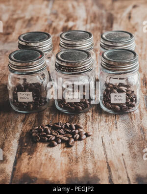 Comparison of Various Indonesia Arabica Coffee Bean In The Jar For Tasting. Coffee Beans Label are Toraja Kalosi, Bali Kintamani and Aceh Gayo Stock Photo