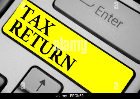 Writing note showing Tax Return. Business photo showcasing which taxpayer makes annual statement of income circumstances Keyboard yellow key Intention Stock Photo