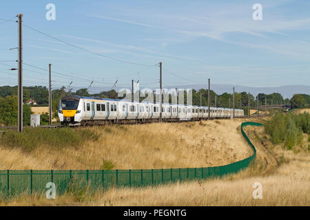 Class 700 electric multiple unit number 700106 working a Thameslink service at Ayres End on the 2nd August 2018. Stock Photo