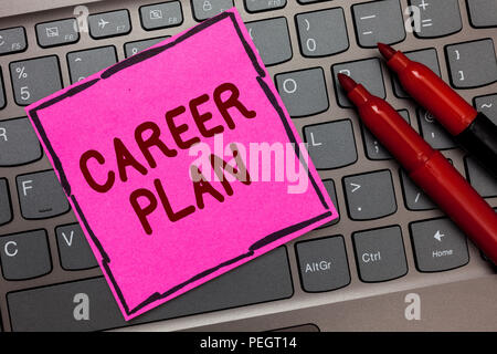 Text sign showing Career Plan. Conceptual photo ongoing process where you Explore your interests and abilities Pink paper keyboard Inspiration communi Stock Photo