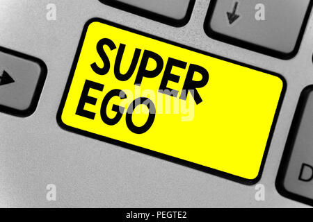 Writing note showing Super Ego. Business photo showcasing The I or self of any person that is empowering his whole soul Keyboard yellow key Intention  Stock Photo