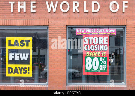 Closing down sale posters displaying in store window Stock Photo