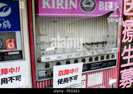 The rare sight of a broken/vandalised vending machine in Japan. Stock Photo