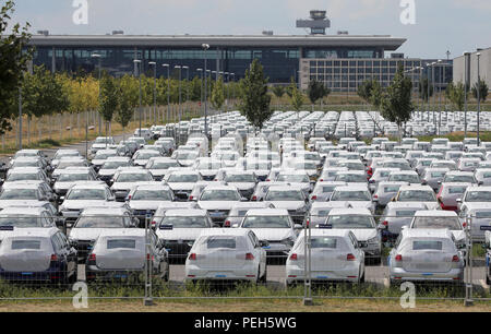 Schoenefeld, Germany. 15th Aug, 2018. Unauthorised Volkswagen vehicles are parked in a car park at BER Airport in Schoenefeld near Berlin, which has not yet been opened. VW has rented around 8,000 parking spaces in three multi-storey car parks and three open spaces at the terminal. Credit: Wolfgang Kumm/dpa/Alamy Live News Stock Photo