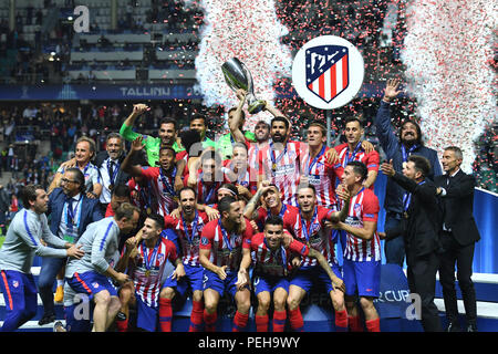 Tallinn, Estonia. 15th Aug, 2018. Football: UEFA Super cup, Real Madrid - Atletico Madrid at Lilleküla Stadium. Atletico Madrid's players cheer with the trophy during the award ceremony. Credit: Marius Becker/dpa/Alamy Live News Stock Photo