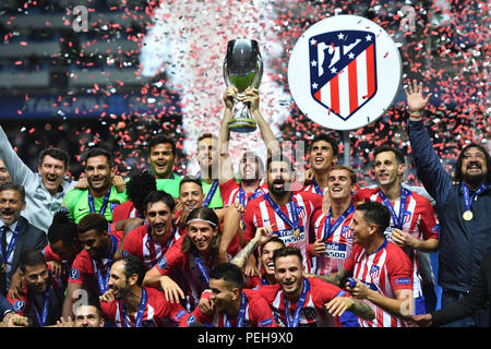 Tallinn, Estonia. 15th Aug, 2018. Football: UEFA Super cup, Real Madrid - Atletico Madrid at Lilleküla Stadium. Atletico Madrid's players cheer with the trophy during the award ceremony. Credit: Marius Becker/dpa/Alamy Live News Stock Photo