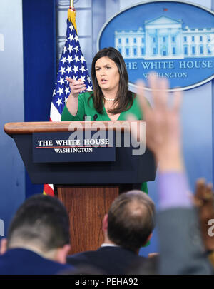 Washington, USA. 15th Aug, 2018. White House spokesperson Sarah Sanders (Rear) attends a press briefing at the White House in Washington, DC, the United States, on Aug. 15, 2018. The White House said on Wednesday that the United States will not lift sanctions on Turkish steel and aluminum products even if detained American pastor Andrew Brunson is released. Credit: Liu Jie/Xinhua/Alamy Live News Stock Photo