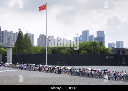 Nanjin, Nanjin, China. 16th Aug, 2018. Nanjing, CHINA-People wait in a long line to visit Memorial Hall of the Victims in Nanjing Massacre by Japanese Invaders in Nanjing, east China's Xinjiang, marking the 73rd anniversary of the victory of Chinese People's Anti-Japanese War and the World Anti-Fascist War. Credit: SIPA Asia/ZUMA Wire/Alamy Live News Stock Photo
