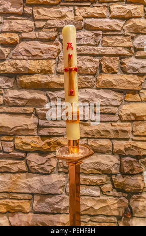 White decorative candle in church Stock Photo