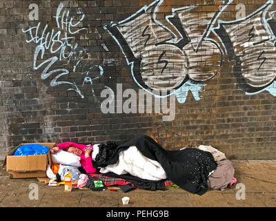 Rough sleeping homeless person, under a railway arch, Manchester, North West England, UK Stock Photo