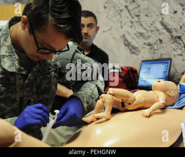 A Health Care Specialist of the 485th Chemical Battalion prepares to ...