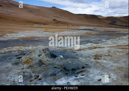 Blackened earth and  empty steam holes at Hverarond or Namaskard, a volcanic area adjacent to Route 1 near Lake Myvatn, Iceland in summertime Stock Photo