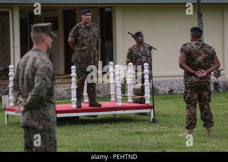 Lieutenant Colonel Lord Veehala with His Majesty’s Armed Forces addresses U.S. Marines with Company B, 1st Battalion, 4th Marine Regiment, Marine Rotational Force – Darwin, during a ‘Welcome to Tonga’ ceremony to start Exercise Tafakula 2015 Aug. 27 at Talai Military Camp, Tongatapu Island, Tonga. Troops from other government services attending the ceremony included His Majesty’s Armed Forces, the New Zealand Defence Force, the French Army of New Caledonia and the Tongan Royal Guards. Defense ties between the United States and our allies and partner nations are critical to regional security an Stock Photo