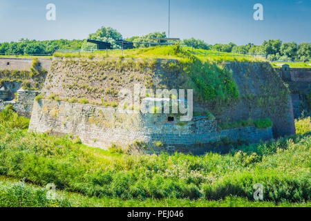 massive old wall with cannons in a beautiful landscape Stock Photo