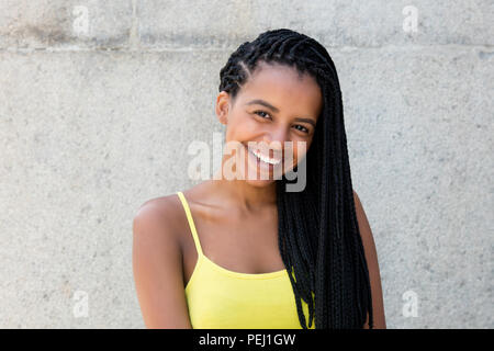 Portrait Of Young Woman With Dreadlocks Laughing Stock