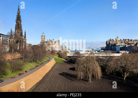 View on old town Edinburgh with the Scott monument on the left and princes street gardens and the train station in the middle Stock Photo