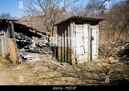 Double outhouse toilets in a village. Rustic old wooden toilets. Stock Photo