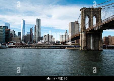 One World Trade Centre, Gehry's tower and Brooklyn Bridge seen from the East River, New York Stock Photo