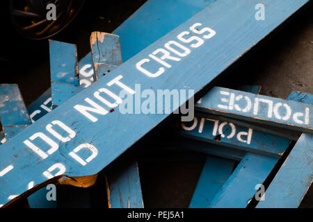 Police line - do not cross - NYPD. Discarded broken barriers on the sidewalk in New York Stock Photo