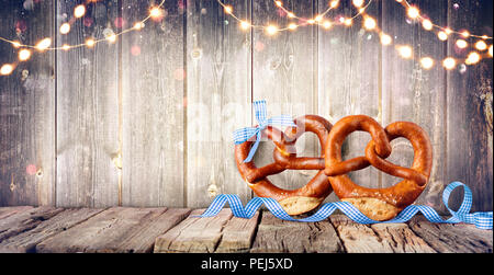 Pretzels And Bavarian Decoration On Wooden Background Stock Photo