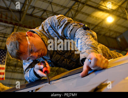 Airman 1st Class Jesse Gordon, 436th Maintenance Squadron crew chief, removes coder pins from an aero seal on a C-5M Super Galaxy during a Maintenance Steering Group-3 major inspection Dec. 2, 2015, in the isochronal dock at Dover Air Force Base, Del. The ISO dock at Dover AFB is the only maintenance dock in the Air Force capable of performing MSG-3 inspections of C-5 aircraft. (U.S. Air Force photo/Senior Airman William Johnson) Stock Photo