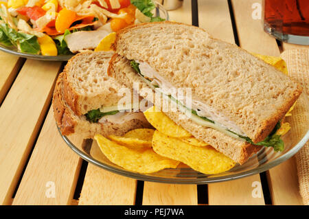 A turkey and swiss cheese sandwich on whole wheat bread Stock Photo