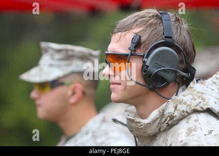 Cpl. David Dudley, Expeditionary Air Field, uses proper eye and ear protection during the 5th annual Combat Shooting Competition Oct. 28, hosted by Weapons Training Battalion aboard Marine Corps Base Quantico. Advanced hearing protection for specific environments allows service members to protect themselves and safely do their jobs. Stock Photo