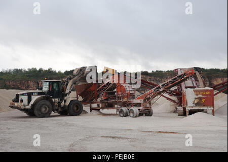 Aggregate is processed to separate and collect the finer material as a process of cement making at whitwell quarry, derbyshire uk. Stock Photo